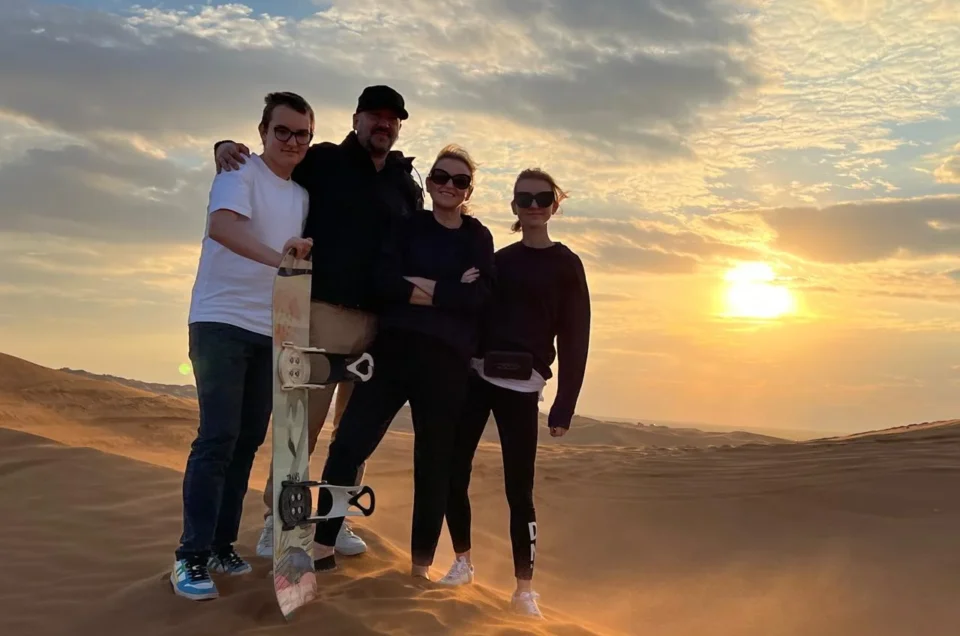 Evening desert safari Dubai with dune bashing, camel rides, BBQ dinner, and live shows